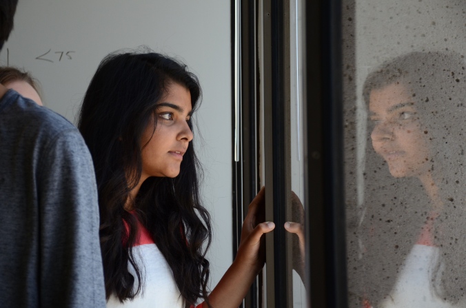 Mosaic reporter Sara Ashary looks out one of the windows in the new Mercury News office. // Photo by Brian Nguyen